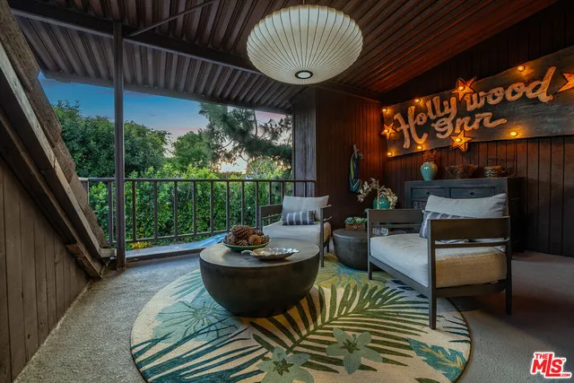 a view of a patio with a dining table and chairs