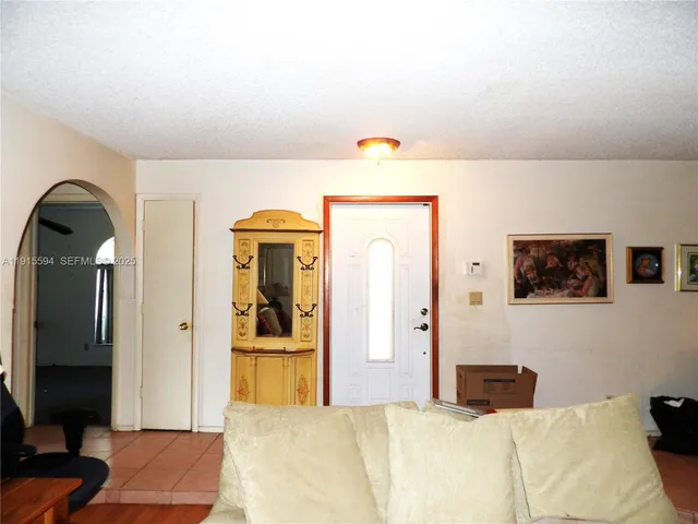 a bedroom with a bed and a mirror