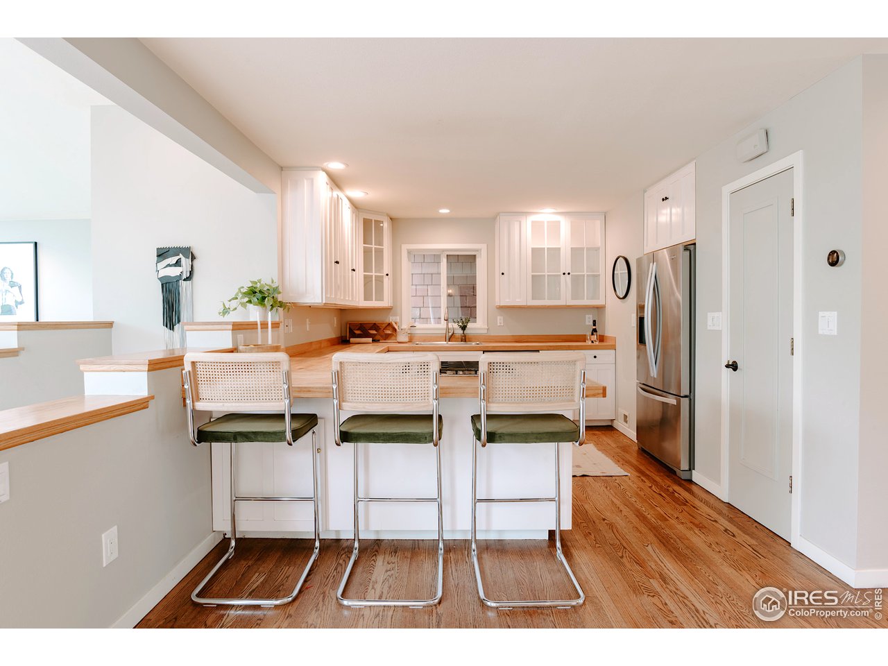 2350 Panorama Avenue Boulder, CO 80304 - Photo 13 of 39 a kitchen with stainless steel appliances kitchen island granite countertop a refrigerator and a stove
