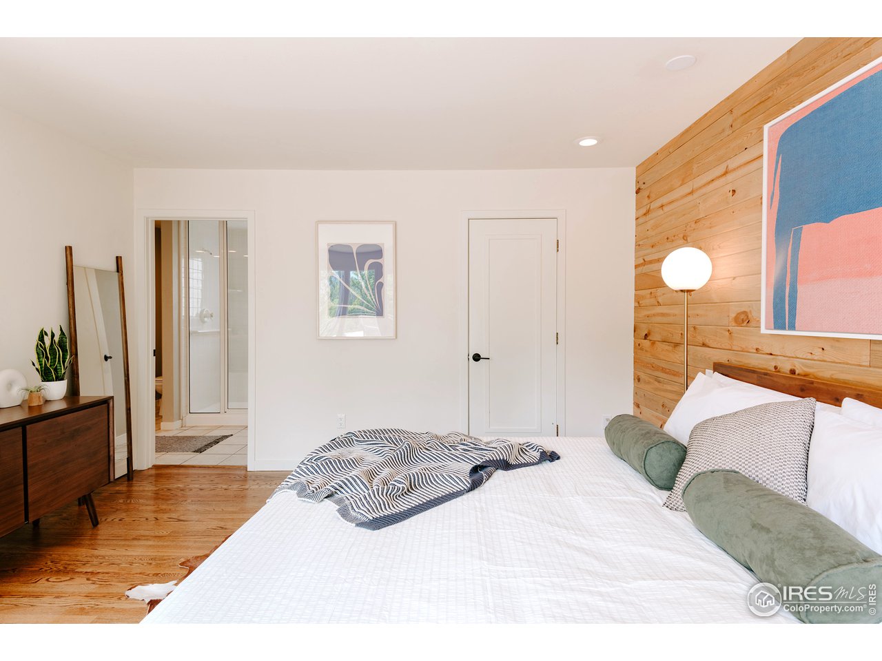 2350 Panorama Avenue Boulder, CO 80304 - Photo 19 of 39 a bedroom with a bed and a large mirror