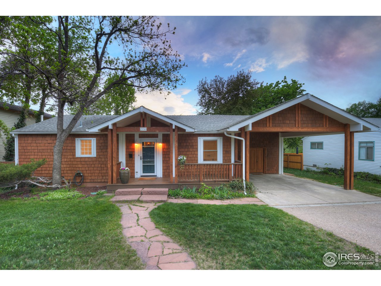 2350 Panorama Avenue Boulder, CO 80304 - Photo 3 of 39 a front view of a house with a yard and garden