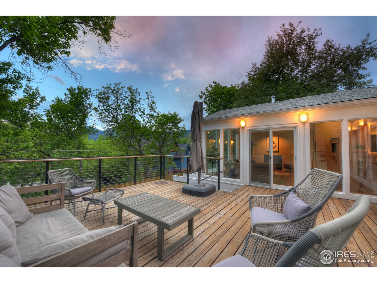 2350 Panorama Avenue Boulder, CO 80304 - Photo 5 of 39 a view of a patio with couches chairs and wooden floor