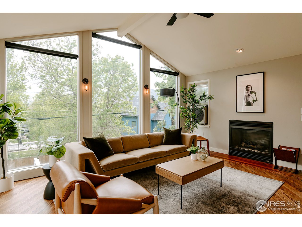 2350 Panorama Avenue Boulder, CO 80304 - Photo 8 of 39 a living room with furniture a large window and a fireplace