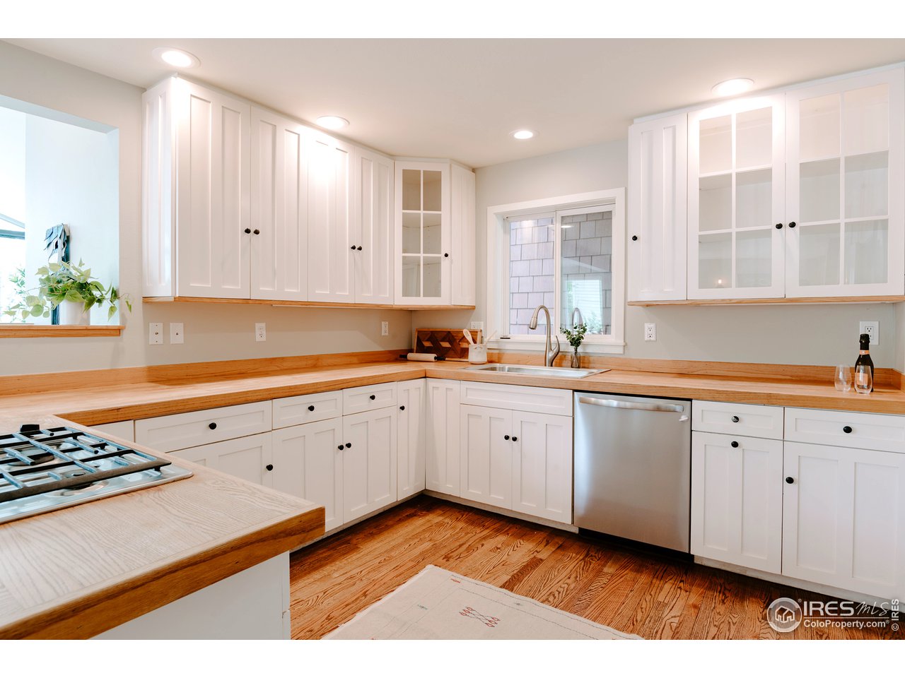 2350 Panorama Avenue Boulder, CO 80304 - Photo 10 of 39 a kitchen with granite countertop white cabinets and white appliances