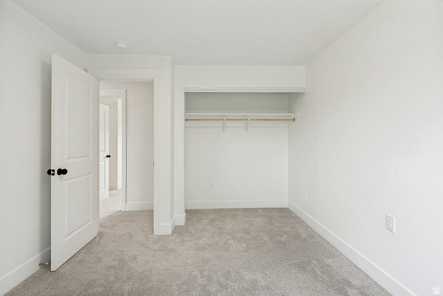 62 South Clark Lane Elk Ridge, UT 84651 - Photo 15 of 30 2nd Bedroom featuring light grey carpet flooring and white walls