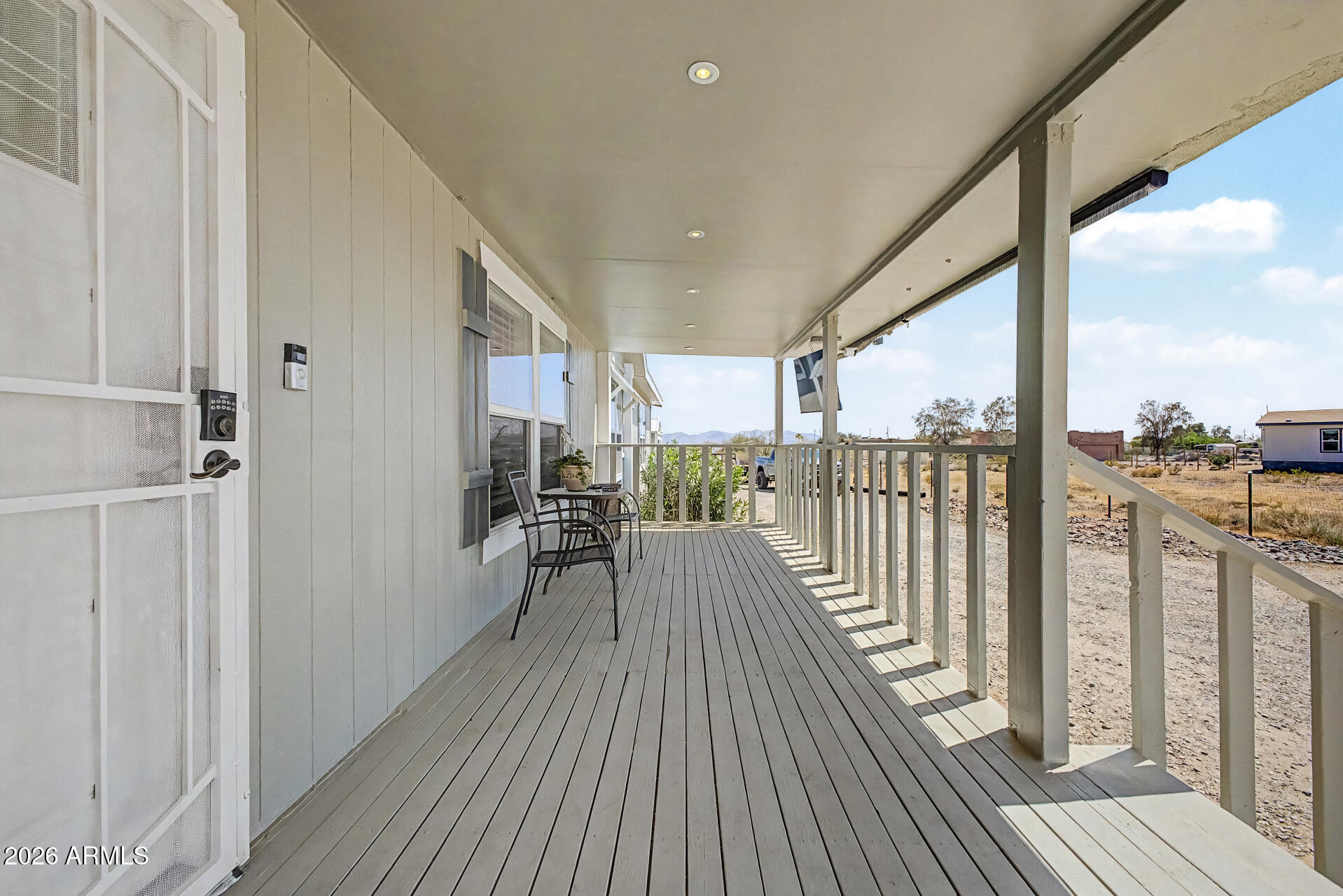 22417 West Dove Valley Road Wittmann, AZ 85361 - Photo 31 of 53 a view of a balcony with wooden floor