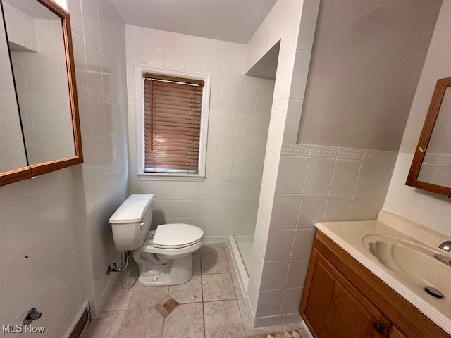 4065 Conover Road Cleveland, OH 44118 - Photo 19 of 24 Bathroom featuring vanity, toilet, tile patterned flooring, and tile walls