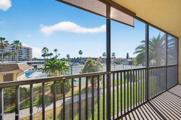 a view of a balcony with city view