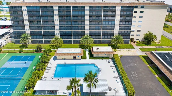 a view of swimming pool with outdoor seating