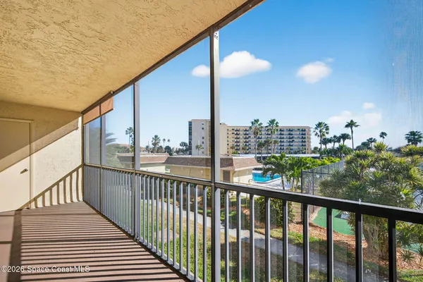a view of a balcony with city view