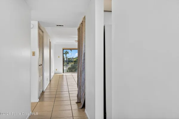 a hallway with wooden floor