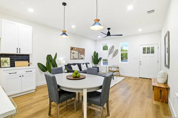 a view of a dining room with furniture and wooden floor