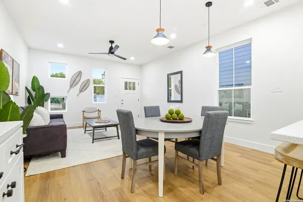 a view of a dining room with furniture window and wooden floor