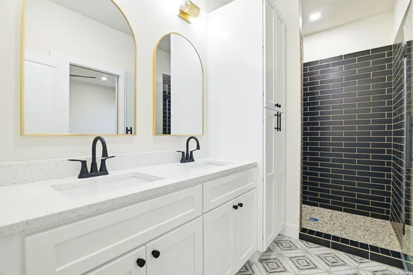 a bathroom with a sink and mirror