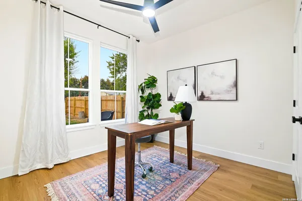 a workspace with furniture and a window