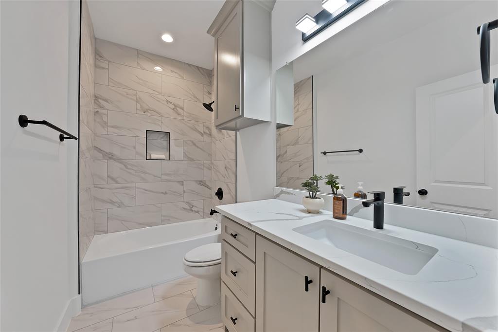 175 Harris Harbor Road East Tawakoni, TX 75472 - Photo 17 of 22 a bathroom with a sink a toilet and shower