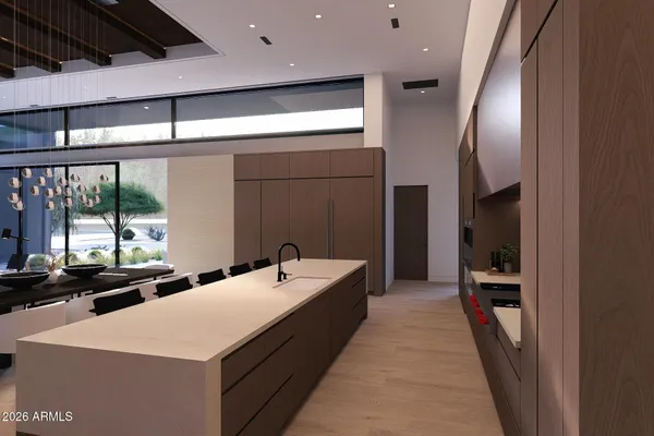 a kitchen with a table chairs and refrigerator