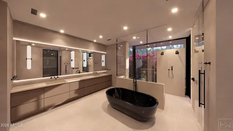 a large hall with stainless steel appliances granite countertop a refrigerator and a sink
