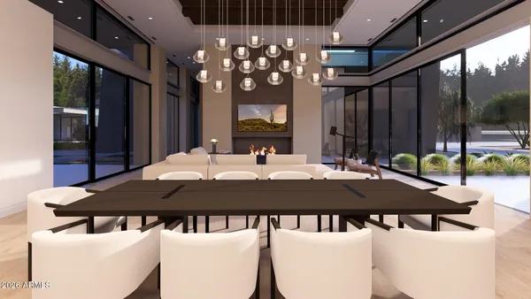 a living room with furniture large window and kitchen view