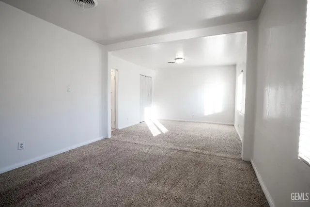 a view of empty room with windows