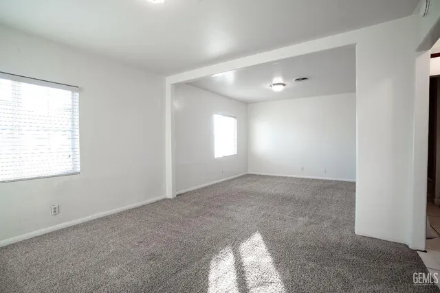 a view of an empty room and window