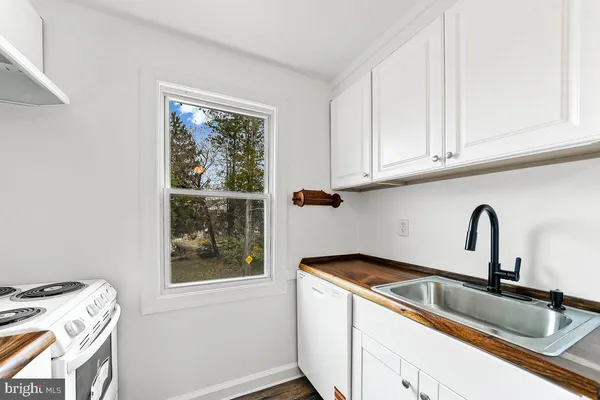 a kitchen with a sink and a window