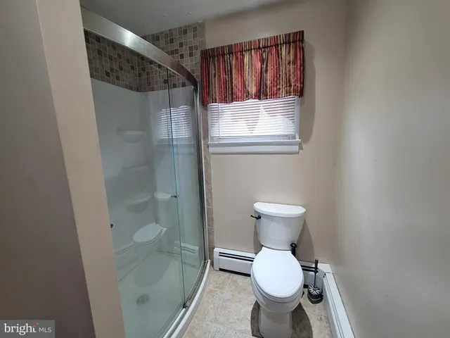 a bathroom with a toilet and a sink