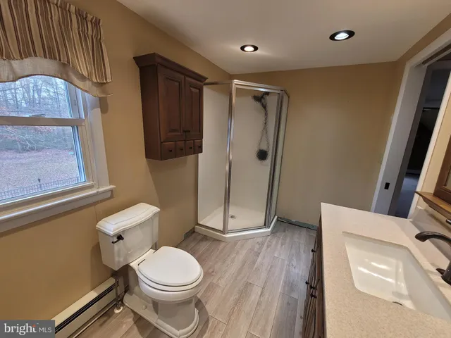 a white toilet sitting next to a bathroom sink