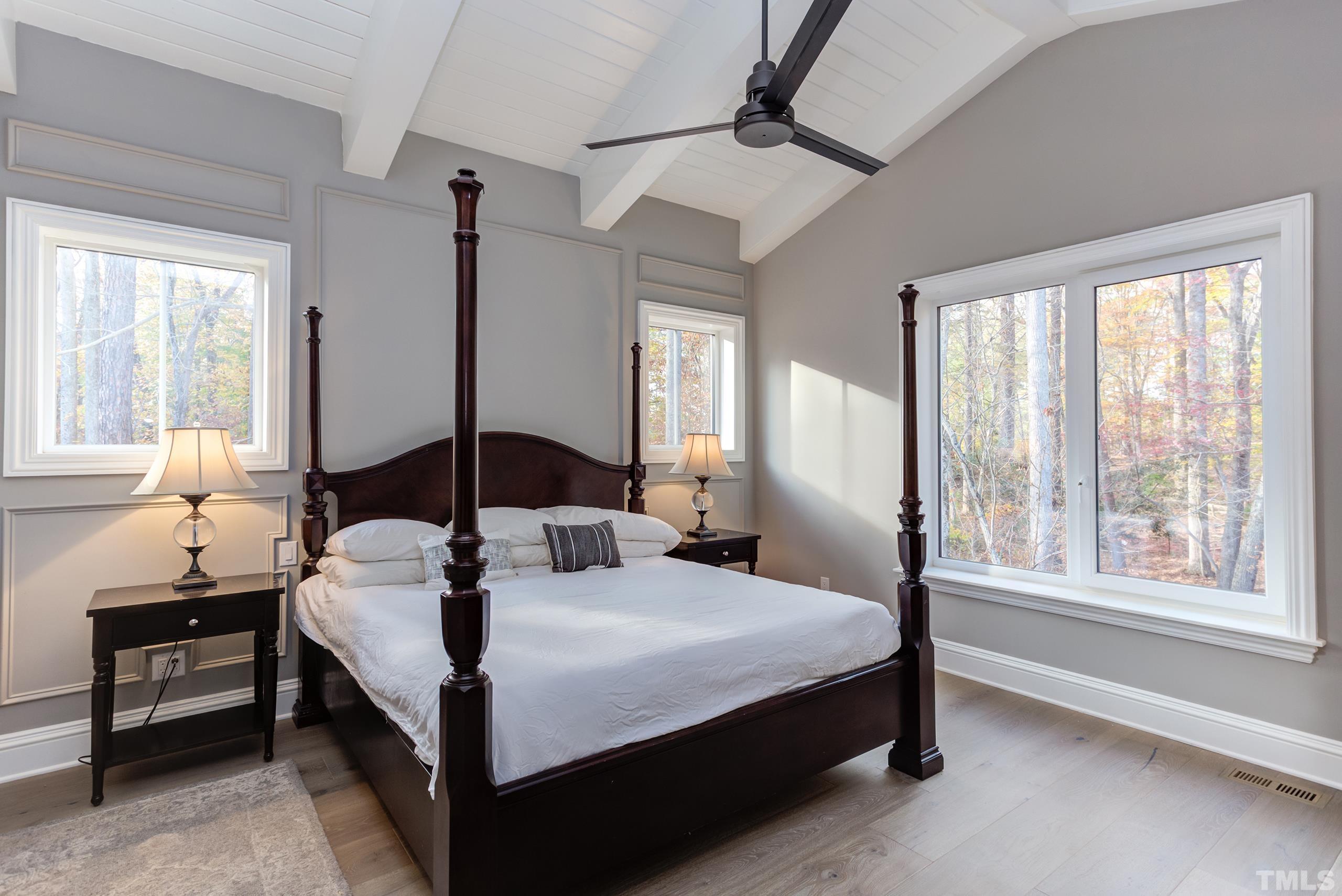 8009 Ghost Pony Trail Raleigh, NC 27613 - Photo 21 of 55 a bedroom with a bed lamp and window