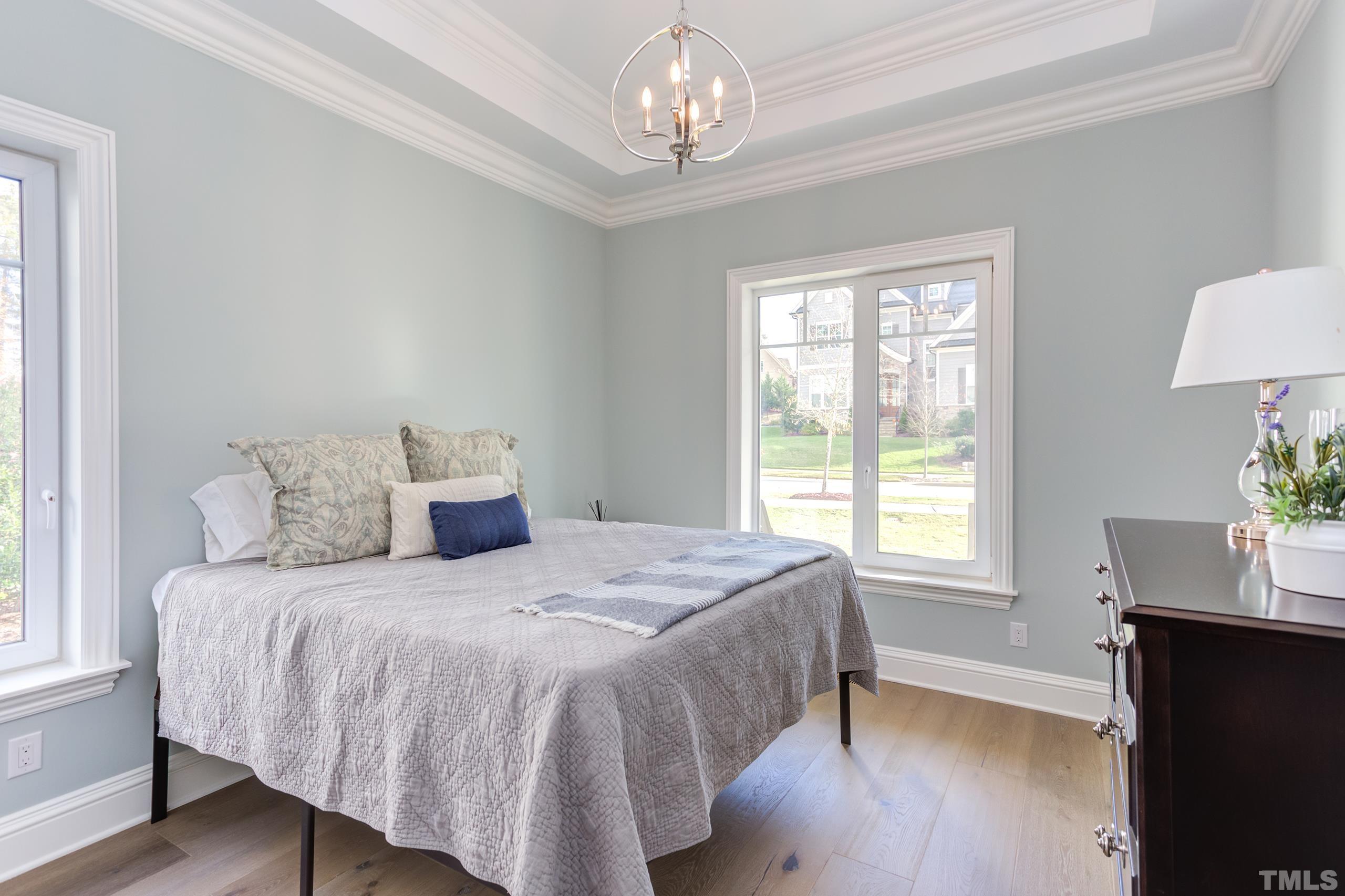 8009 Ghost Pony Trail Raleigh, NC 27613 - Photo 28 of 55 a spacious bedroom with a bed and a window