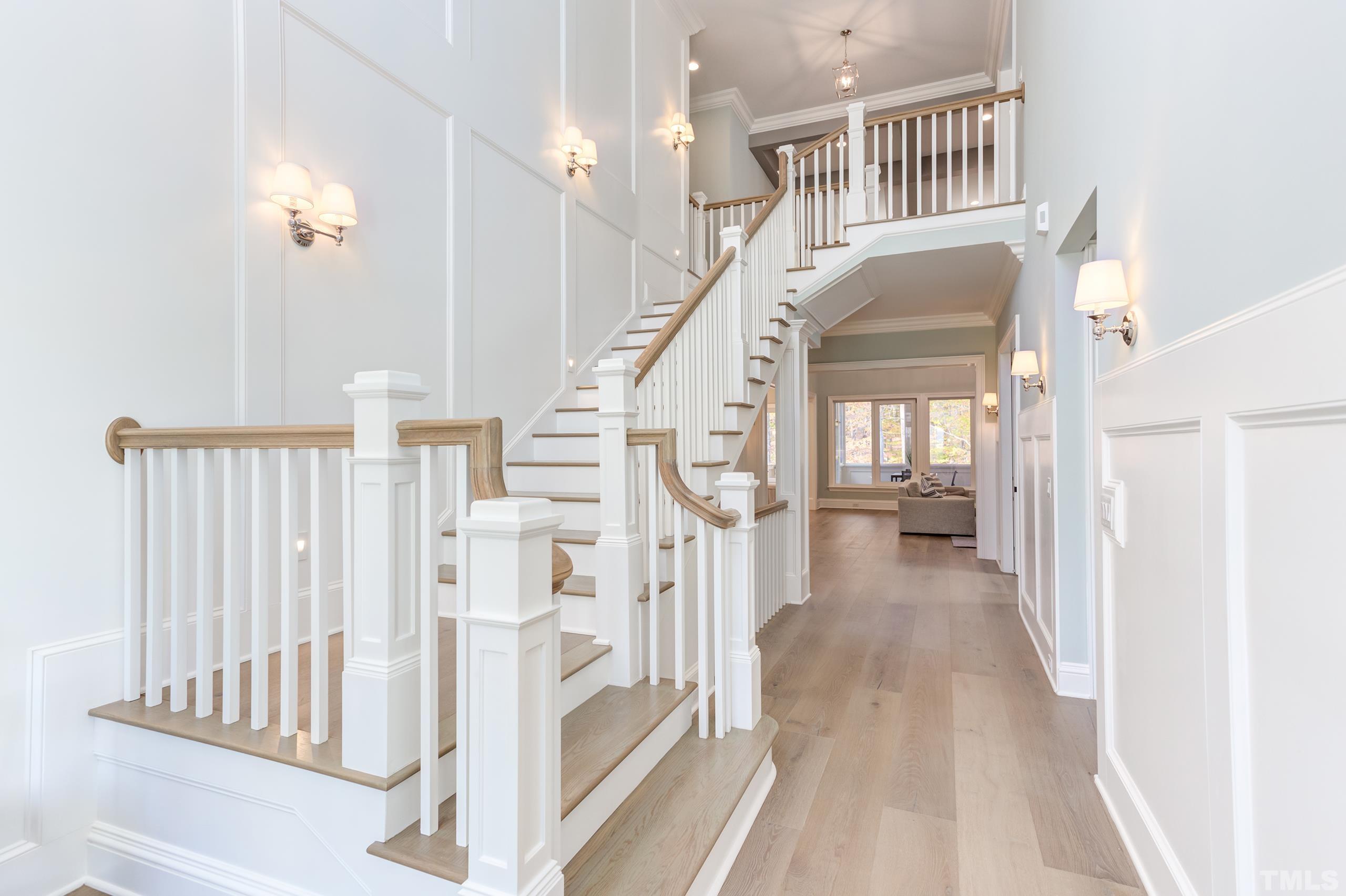 8009 Ghost Pony Trail Raleigh, NC 27613 - Photo 3 of 55 a view of staircase with white walls and a window