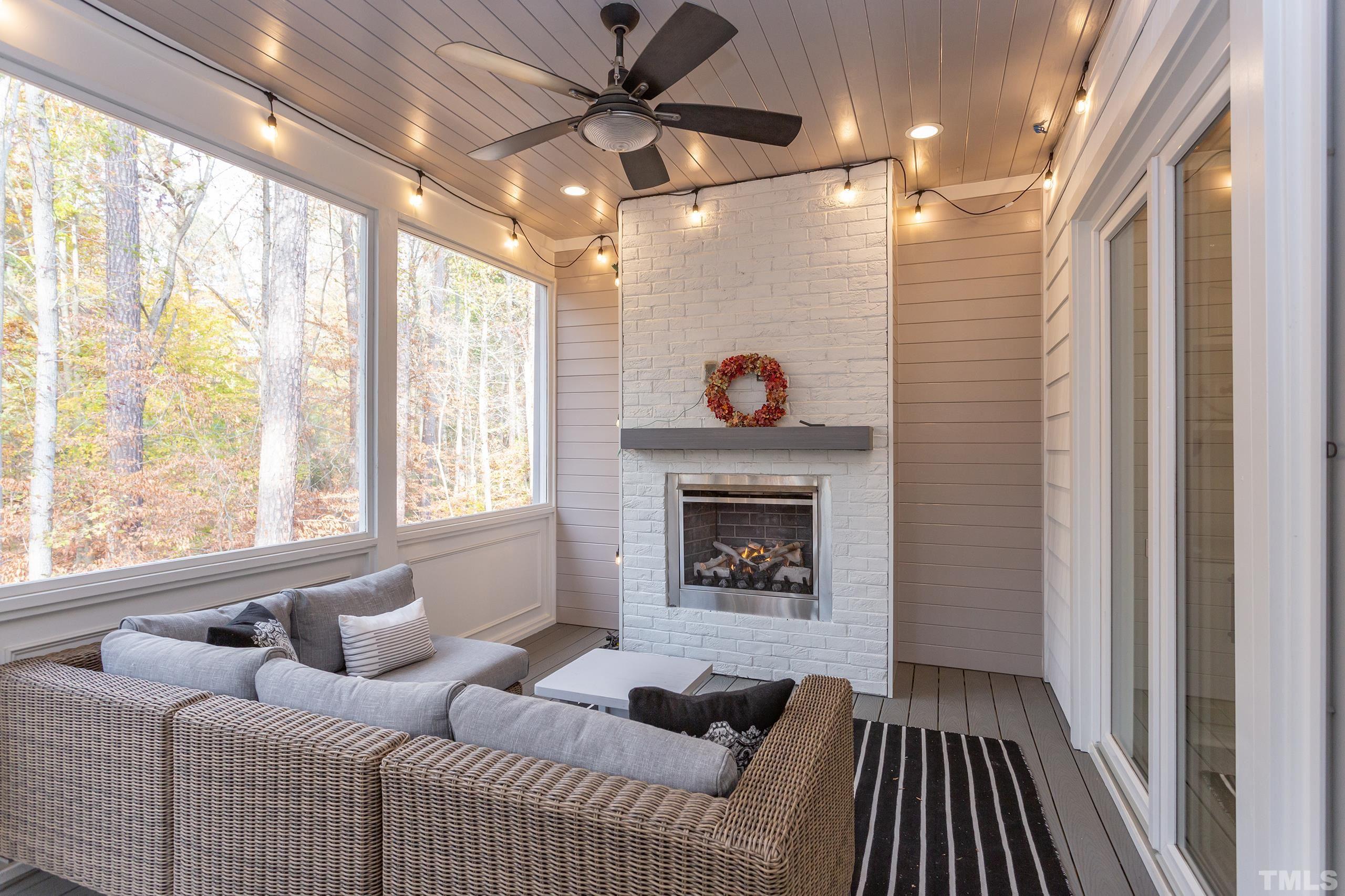 8009 Ghost Pony Trail Raleigh, NC 27613 - Photo 42 of 55 a living room with furniture and a fireplace