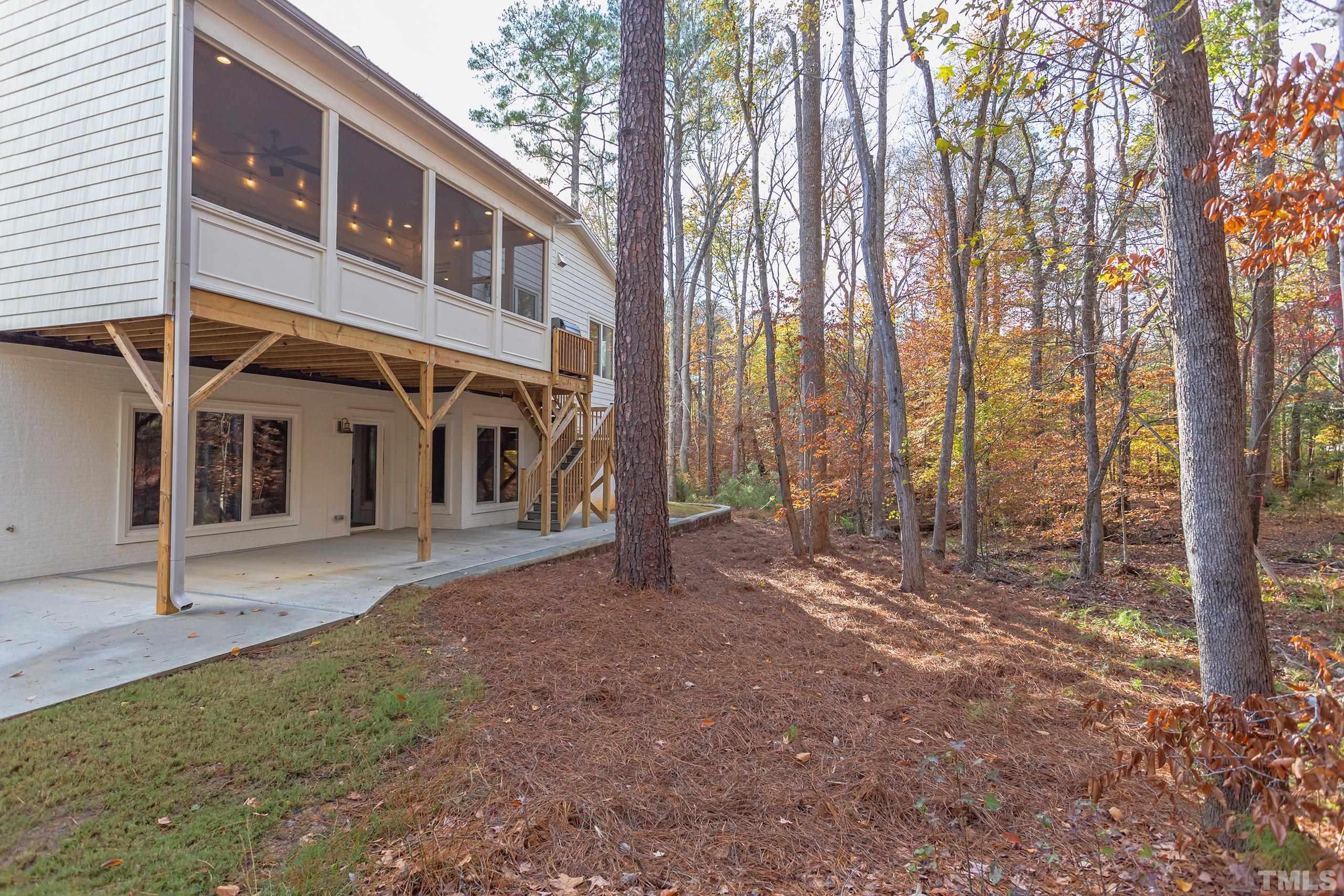 8009 Ghost Pony Trail Raleigh, NC 27613 - Photo 46 of 55 a view of a house with a yard and tree s