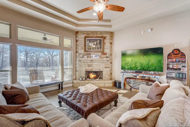 a kitchen with stainless steel appliances granite countertop a sink a stove and a refrigerator