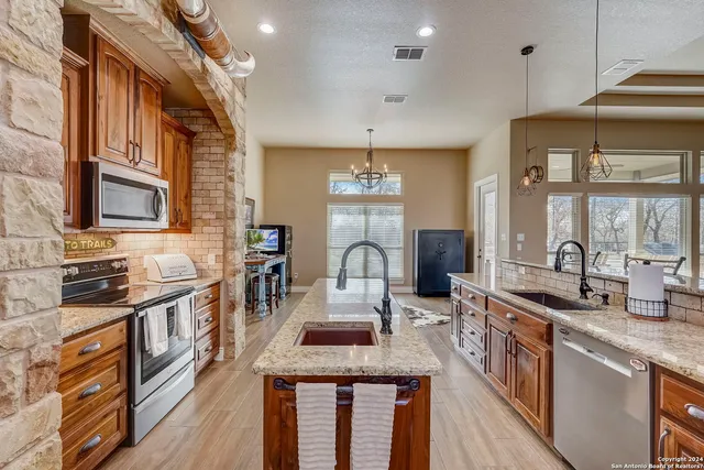 a living room with a piano and a rug