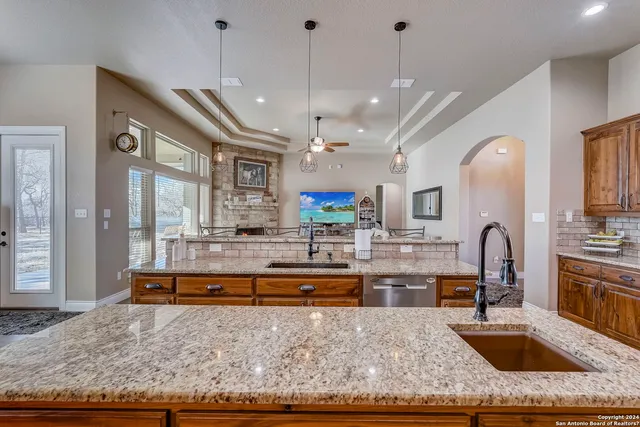 a bedroom with a bed table and window