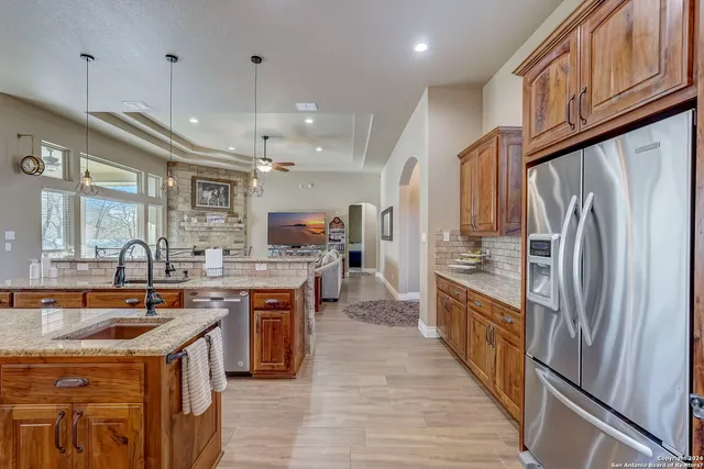 a bathroom with a sink mirror and shower
