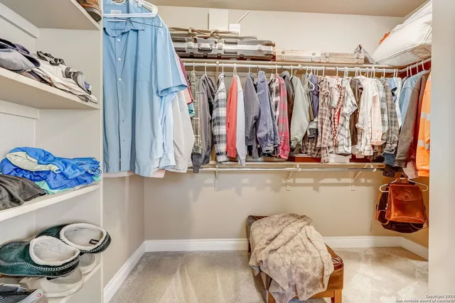 a bedroom with a bed a desk and chair