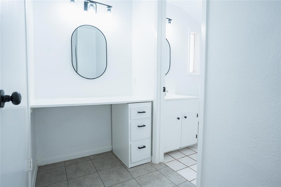 4509 Hogan Street Corpus Christi, TX 78413 - Photo 13 of 27 a bathroom with a mirror a sink and a mirror