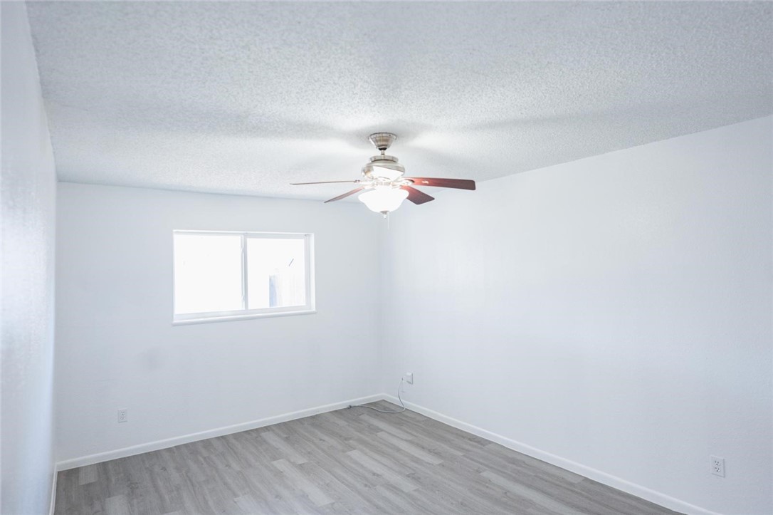 4509 Hogan Street Corpus Christi, TX 78413 - Photo 14 of 27 an empty room with a window and ceiling fan