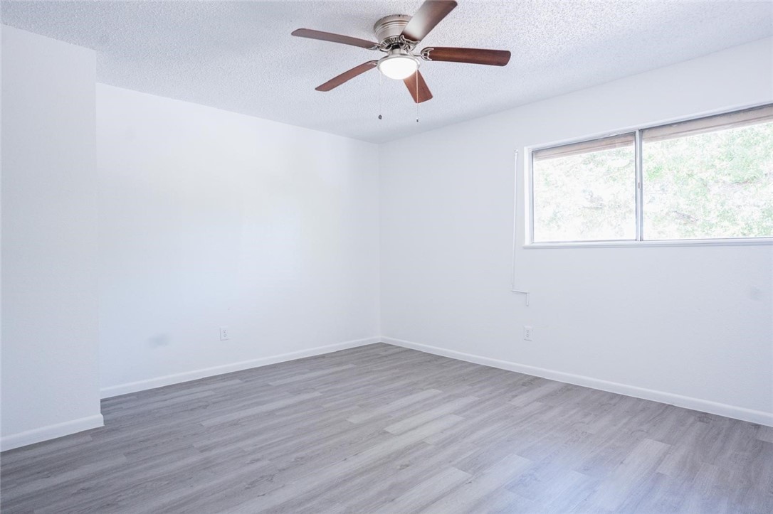 4509 Hogan Street Corpus Christi, TX 78413 - Photo 18 of 27 wooden floor in an empty room with a window