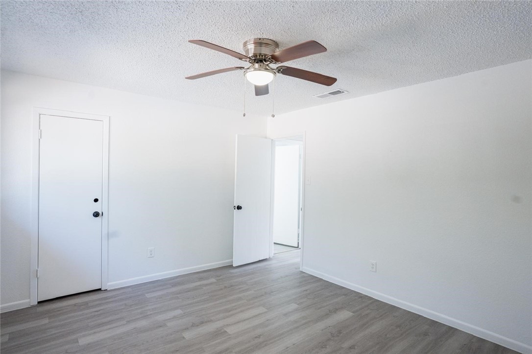 4509 Hogan Street Corpus Christi, TX 78413 - Photo 19 of 27 a view of an empty room with wooden floor