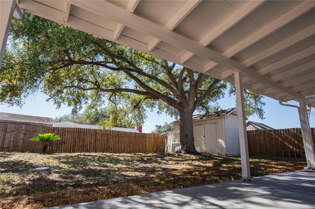 4509 Hogan Street Corpus Christi, TX 78413 - Photo 22 of 27 a view of a backyard with a tree