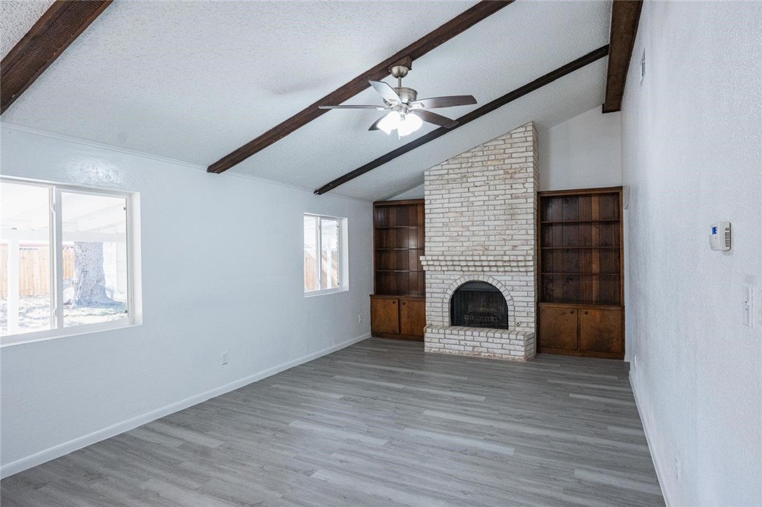 4509 Hogan Street Corpus Christi, TX 78413 - Photo 7 of 27 a view of a livingroom with a fireplace window and wooden floor