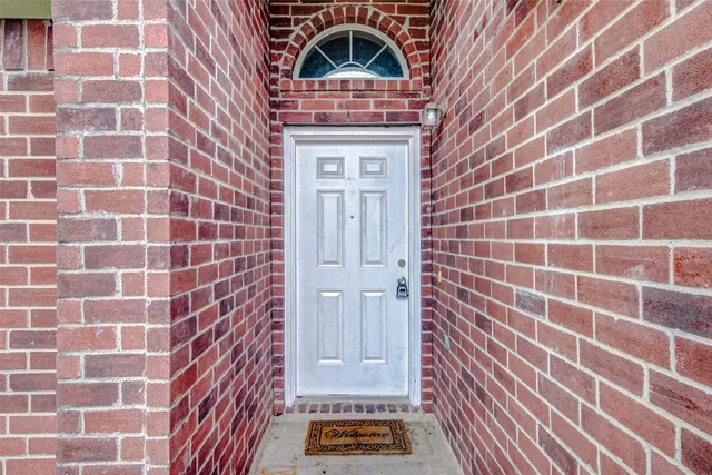 a bathroom with a window and a shower