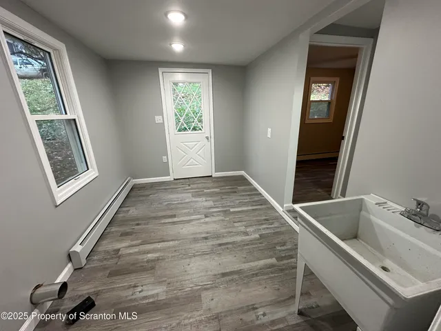 a view of an empty room with a window