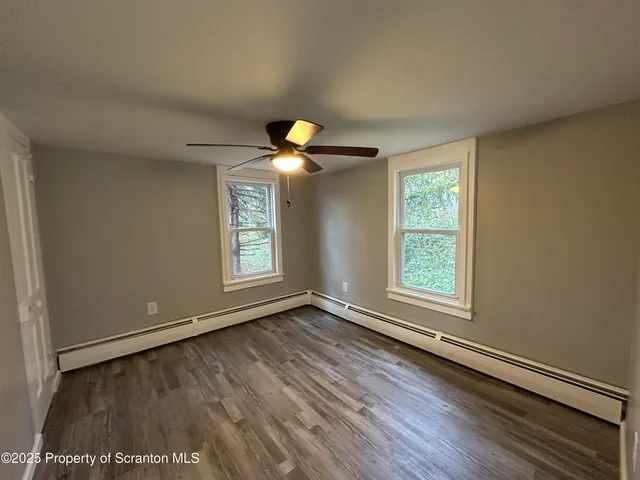 a bathroom with a sink toilet and mirror