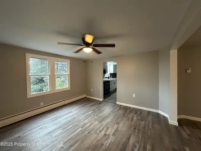 a view of an empty room with a window