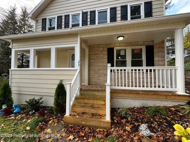 a front view of a house with a porch