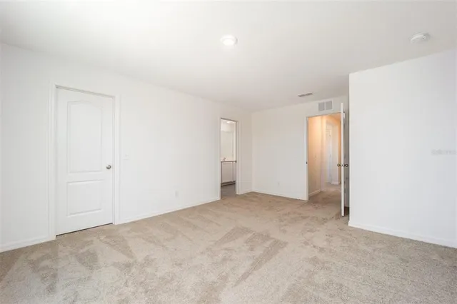 a bathroom with double vanity sink and mirror